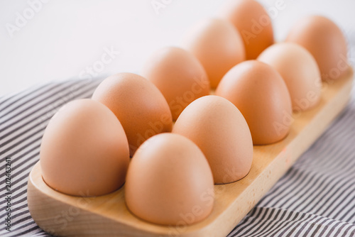Farm raw fresh egg in pack on gray table ingredient for breakfast preparation scrambled eggs omelet fried egg