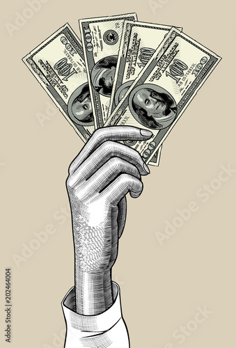 Woman's hand palm down with fan of 100 dollars bank notes