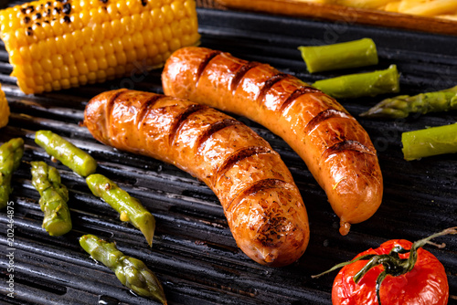 grilled krakauer with french fries and green salad photo