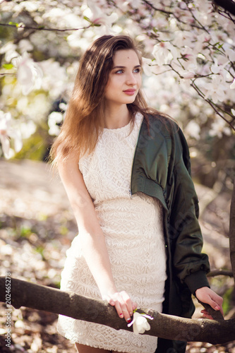 girl posing in magnolia garden
