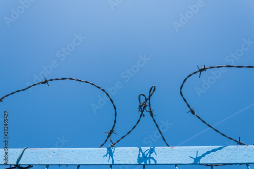 Barbed wire at a gate photo