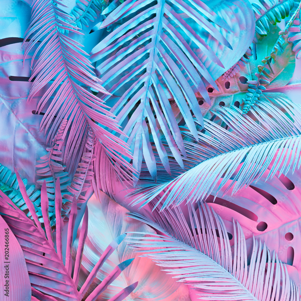 Tropical and palm leaves in vibrant bold gradient holographic neon  colors. Concept art. Minimal surrealism background. - obrazy, fototapety, plakaty 