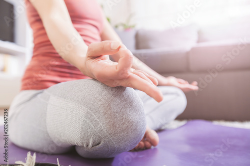 Woman meditates practicing Yoga