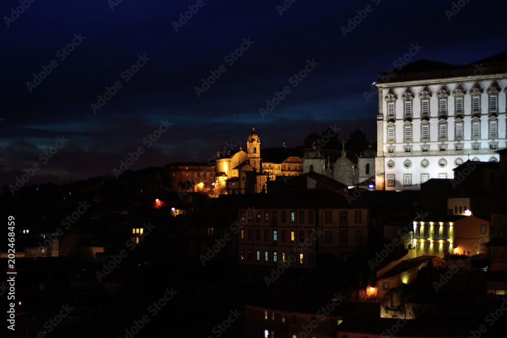 View of Douro river and Ribeira at night time, Porto, Portugal.