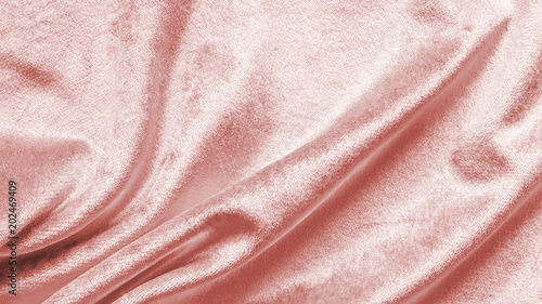 Rose gold pink velvet background or velour flannel texture made of cotton or wool with soft fluffy velvety satin fabric cloth metallic color material photo