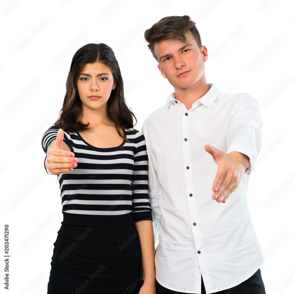 Young couple handshaking after good deal on isolated white background Young couple handshaking after good deal on isolated white background