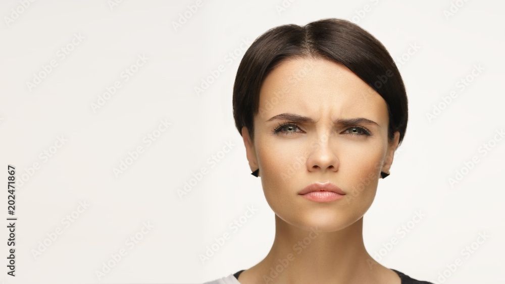 Obraz premium Emotional portrait of a beautiful girl. Short haircut.