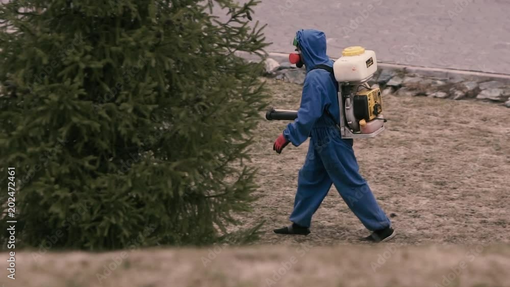 Virologist man in protective costume and respirator gas mask. Virologist man in protective costume and respirator gas mask.