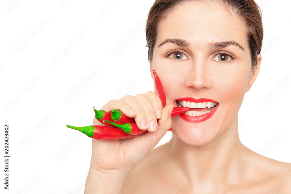 Beautiful woman teeth eating red pepper Beautiful woman teeth eating red pepper