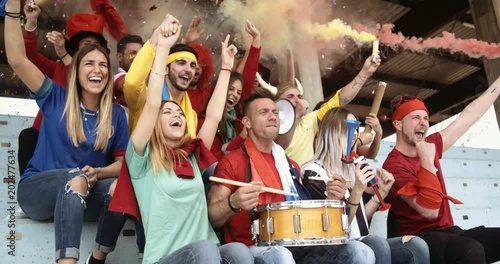 sport supporters at the stadium. shot in slow motion