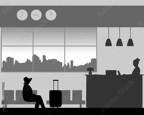 The girl with hat sits in the lobby of the hotel and waits silhouette