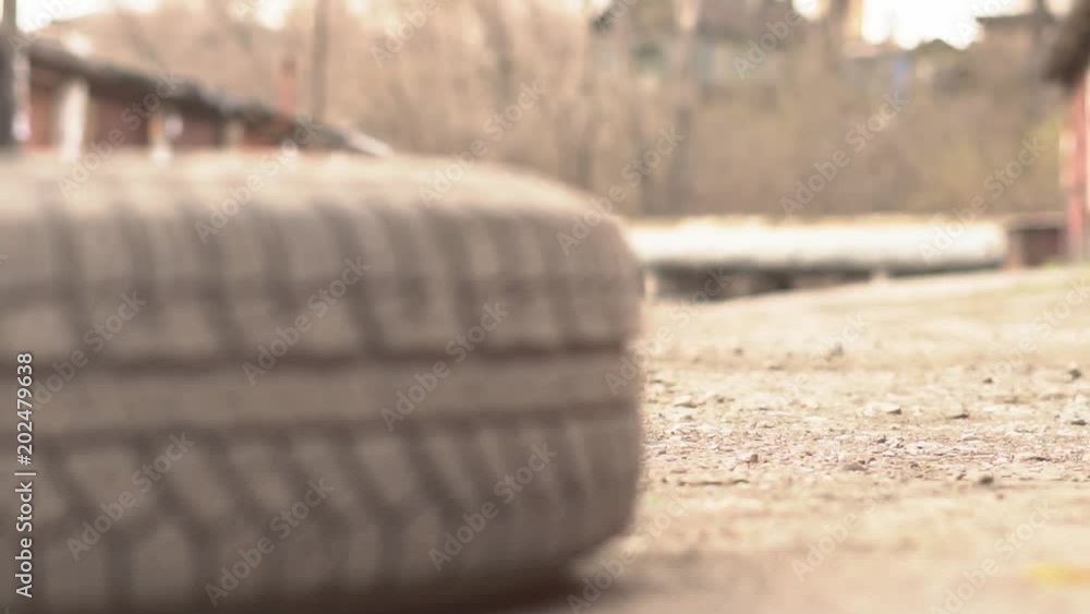 Mechanic Holding Car Tire At Garage Mechanic Holding Car Tire At Garage