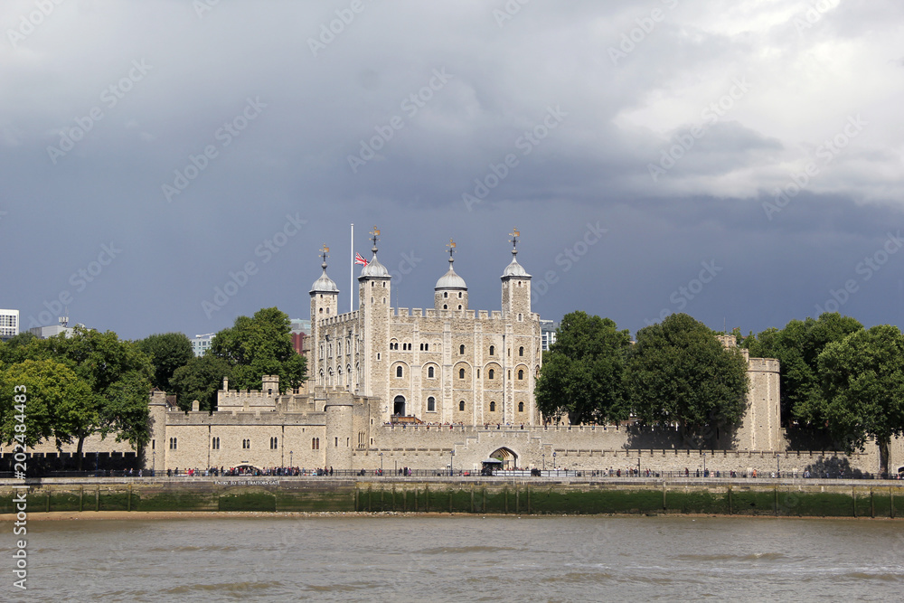 Tower of london with heavy clouds in the background
