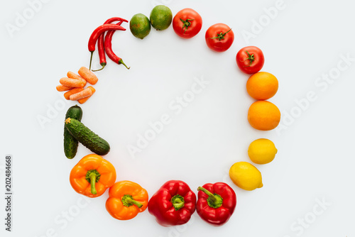 top view of circle of vegetables and fruits isolated on white