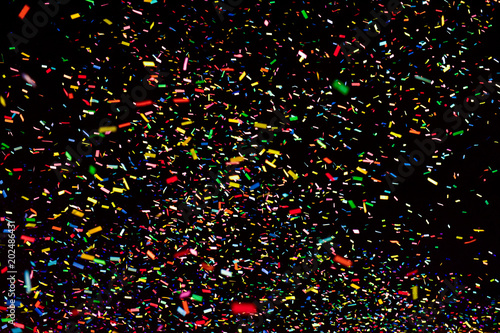 Bild auf Leinwand Thousands of confetti fired on air during a festival at night