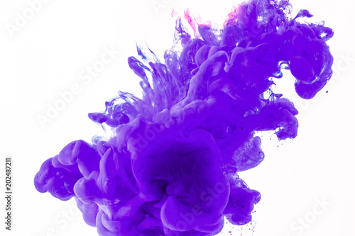 creative design with purple paint flowing in water, isolated on white