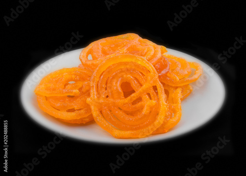 Jalebi, also Know as imarti, imarati, paneer jalebi or zulbia is a Indian sweet food, It is made by deep-frying a wheat flour batter in pretzel or circular shapes
