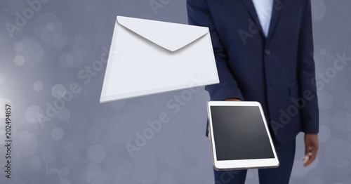 Fototapeta Naklejka Na Ścianę i Meble -  Envelope letter message and man using tablet
