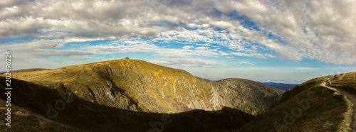 Panoramic view of the occidental slope of the Hohneck in a sunny and cloudy afternoon. Vosges mountains, France.