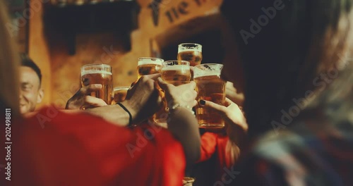 group of friends at the pub. shot in slow motion