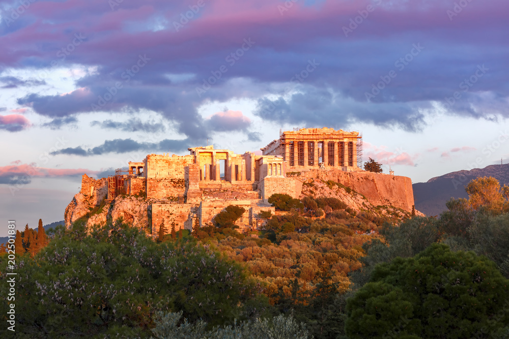 Aerial view of the Acropolis Hill, crowned with Parthenon at sunset in Athens, Greece