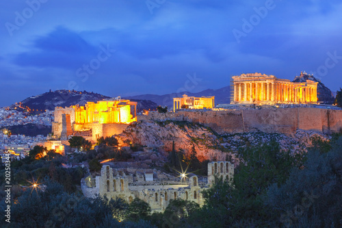 Aerial view of the Acropolis Hill, crowned with Parthenon during evening blue hour in Athens, Greece