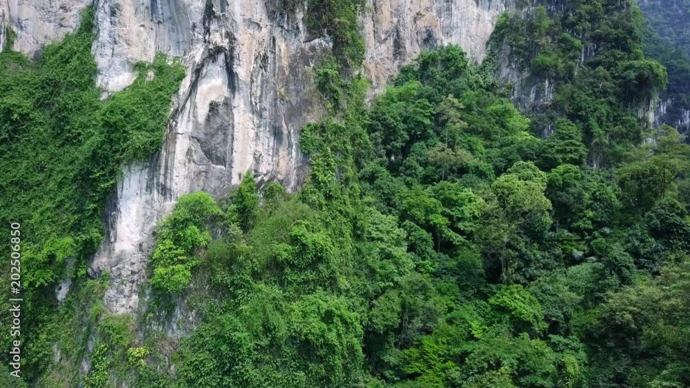 Aerial View of Limestone Rocks Covered with Lush Tropical Greenery. Top View of Mountains in Krabi and Suratthani Provinces, Thailand. Aerial View of Limestone Rocks Covered with Lush Tropical Greenery. Top View of Mountains in Krabi and Suratthani Provinces, Thailand.