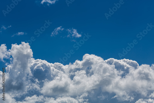 Clouds against the background of the blue sky