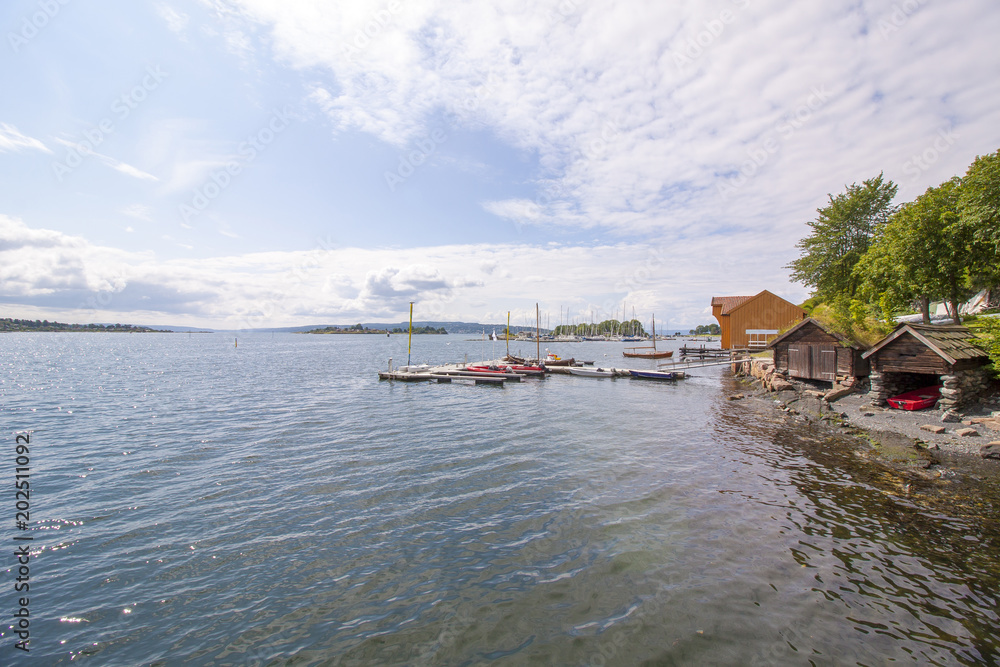 Fototapeta premium Yachts moored at town quay In Sunny Summer Day in Oslo, Norway. 