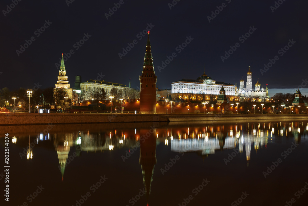 Moscow Kremlin at night with reflection on the water of Moskva river
