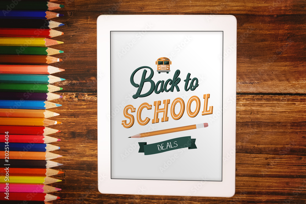 back to school against students desk with tablet pc back to school against students desk with tablet pc