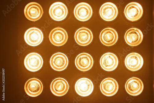 Light bulbs background over dark wall