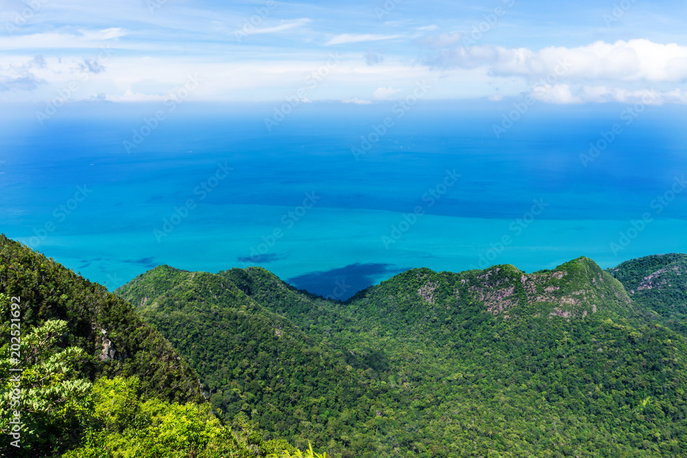 Mountain covered jungle on tropical island in sea in Malaysia, Langkawi