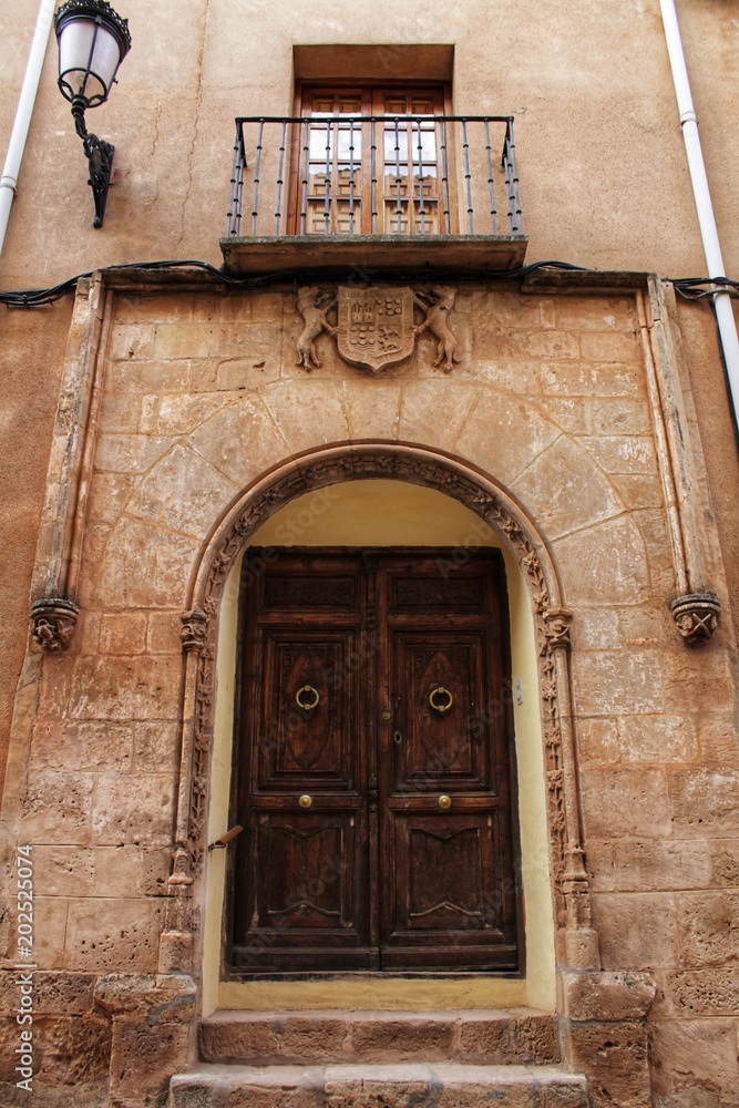 Old facade and entrance of majestic house in Alcaraz, Albacete province, Spain