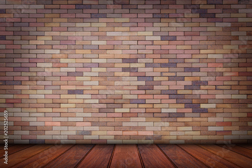 Wood floor with brick wall background