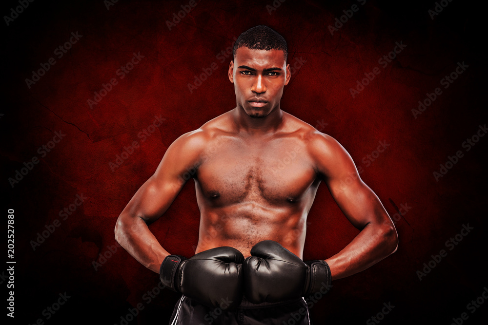 Fototapeta premium Muscular boxer against dark background