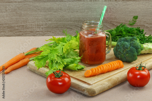 Fresh vegetable cocktail from tomatoes, broccoli, spinach and carrots