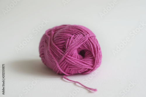 Balls of wool on wooden background, old retro vintage style