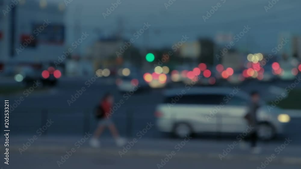 City lights and cars driving in blurred traffic background, Out of focus background with blurry unfocused city lights and driving cars and car light. Astrakhan Russia City lights and cars driving in blurred traffic background, Out of focus background with blurry unfocused city lights and driving cars and car light. Astrakhan Russia