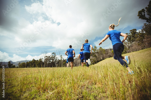 Fit people running in bootcamp