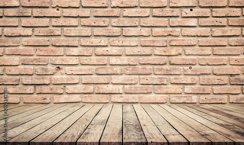old wood desk or wood floor with abstract old brick wall background