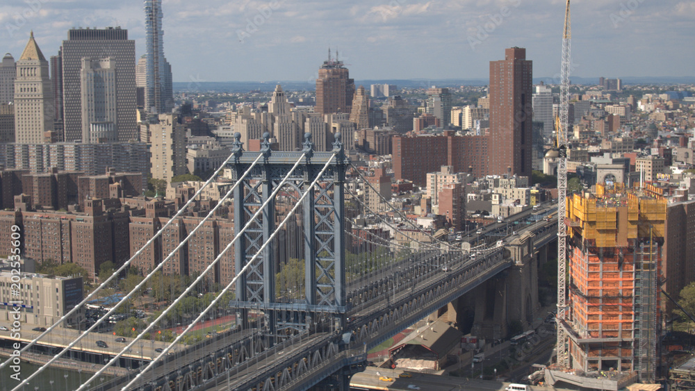 AERIAL: Busy Manhattan bridge freeway running from Brooklyn into New York City
