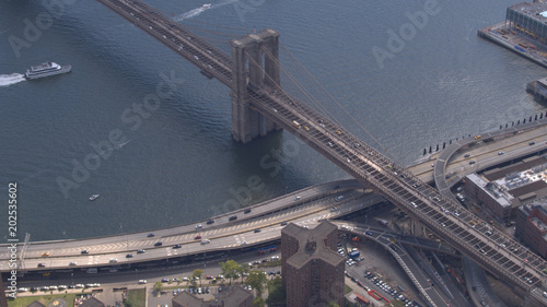AERIAL: Congested traffic on busy Brooklyn bridge highway interchange overpass
