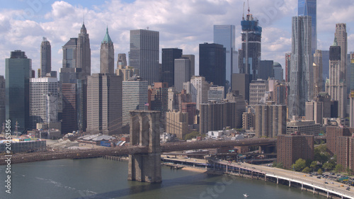 AERIAL: Famous Brooklyn Bridge against Lower Manhattan downtown cityscape © helivideo