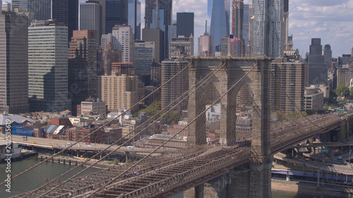 AERIAL: Magnificent Brooklyn Bridge against Lower Manhattan downtown cityscape © helivideo