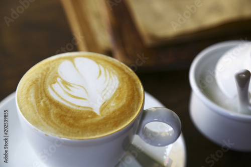 Cappuccino and sugar on the table