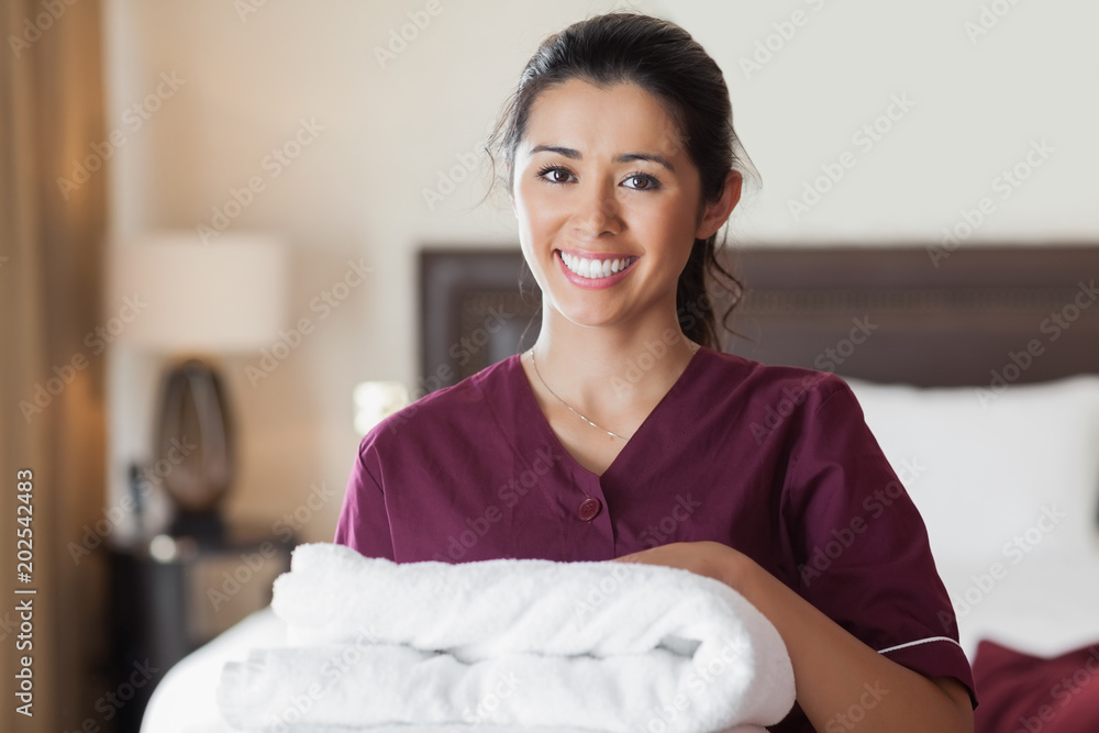 Fotografie Happy maid with towels