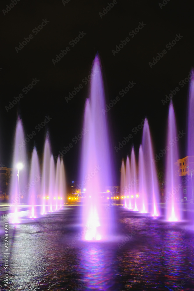 colored water fountain at night colored water fountain at night