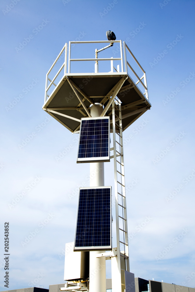 beacon sky solar panels top light house transformation energy blue white sun saving beam two beach port harbor beacon sky solar panels top light house transformation energy blue white sun saving beam two beach port harbor