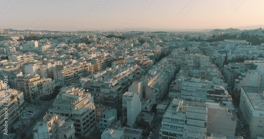Aerial of downtown neighbourhoods streets and rooftops of Athens. Aerial of downtown neighbourhoods streets and rooftops of Athens.